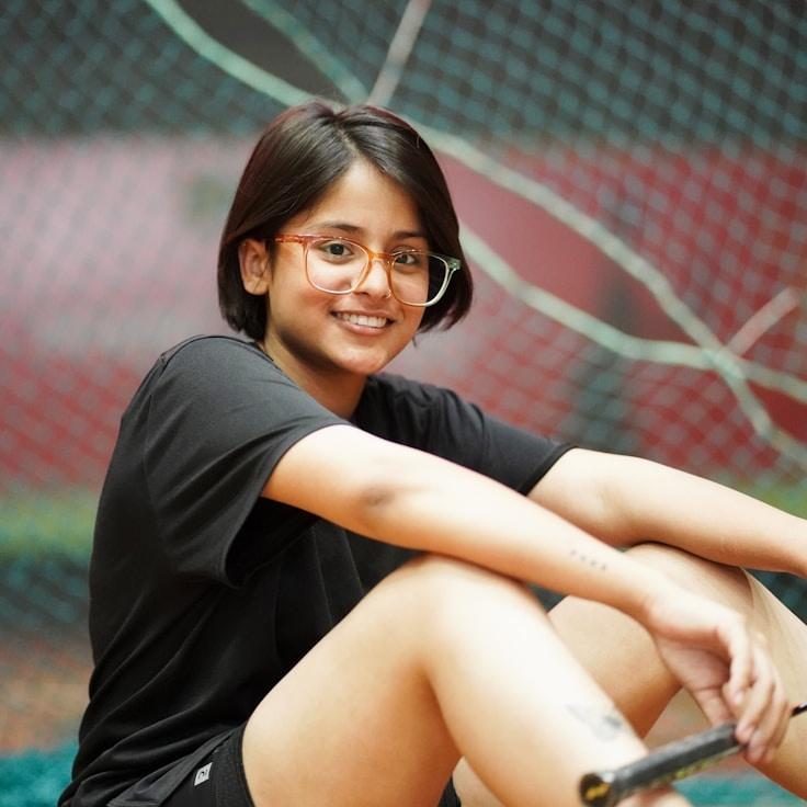 Kaveri Mehta, Lead Design Curator at Blue Harbor Studio, reviewing corporate floral arrangements